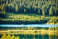 a small boat on the lake with a forest on the rocks. Royalty Free Stock Photo