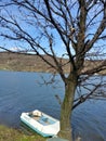 Small boat on a lake shore Royalty Free Stock Photo