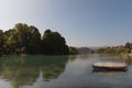 Small boat in a lake under a blue sky