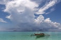 a small boat in a large body of water on bantayan island in the Philippines Royalty Free Stock Photo