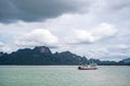 A small boat in a large body of water Royalty Free Stock Photo