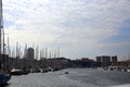 Small boat leaving the harbor in the evening, among the moored boats, Marseille, France Royalty Free Stock Photo