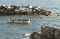 Small Boat leaving Shore in Riomaggiore Italy