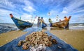 A small boat local fishery group is removing crabs, fish and sea creatures caught from their nets at Jomtien Beach