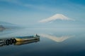 a small boat at a port with morning mist and FujiSan & x28;mt. Fuji& x29; Royalty Free Stock Photo