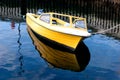 Small boat reflecting on sea Royalty Free Stock Photo