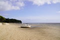Small boat in sand beach at low tide at Ares in Arcachon Bay Gironde department France Royalty Free Stock Photo