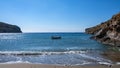 Small boat on the sea, blue clear sky, calm sea water and sandy beach background Royalty Free Stock Photo