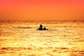 Small boat silhouette with two rural fishermen Royalty Free Stock Photo