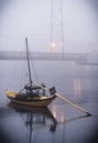 Small boat, silhouetted against a foggy backdrop in Porto