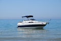 A small boat yacht in the sea near the shore. Royalty Free Stock Photo