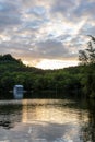 Small Boathouse by a Lake During Sunset