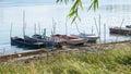 Small boats berthed along the river autumn day