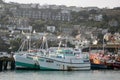 Small boats in busy fishing harbour Royalty Free Stock Photo