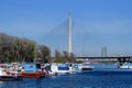 Small boats docked at the Sava River Yacht Harbor, and modern land bridge which connects Ada Ciganlija Island. Belgrade Royalty Free Stock Photo