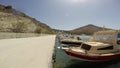 Small boats docket in a little harbor of Molos in the island of Paros,