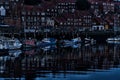 Small boats at dusk on the River Esk, Whitby, North Yorkshire.