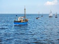 small group of boats at high tide on moorings at Meol beach the Wirral UK Royalty Free Stock Photo