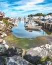Small boats lining waterfront in Wickford Cove Royalty Free Stock Photo