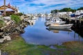 Small boats lining waterfront in Wickford Cove Royalty Free Stock Photo