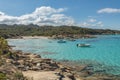 Boats in a small cove with sandy beach in Corsica Royalty Free Stock Photo