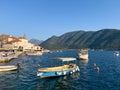 Perast, Montenegro - 03 august 2023: Small boats are moored off the coast of the ancient town of Perast. Montenegro