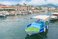 Small boats moored in sea canal with restaurants around