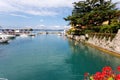 Small boats moored in a sheltered marine harbor