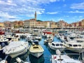 Small boats packed in the bay on a beautiful summer day in Rovinj, Croatia on the Istria Peninsula.