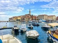 Small boats packed in the bay on a beautiful summer day in Rovinj, Croatia on the Istria Peninsula.