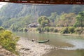 Small boats parked on the shore near Tham Chang cave, Laos. Royalty Free Stock Photo