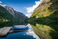 Small boats at scenic fjord landscape.