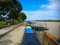 Small boats that are used as a means of transportation for the surrounding community are leaning on the banks of the Kayan River Royalty Free Stock Photo