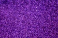 Small bokeh light sparkle shining on violet purple background for abstract glitter