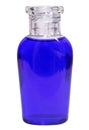Small bottle with blue liquid on white background