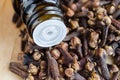 Small bottle with essential clove oil. Aromatherapy and herbal medicine. Copy space Royalty Free Stock Photo