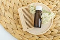 Small bottle with essential yarrow oil and yarrow flowers. Aromatherapy, homemade beauty treatment and herbal medicine Royalty Free Stock Photo