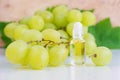 Small bottle with grapeseed oil. Natural beauty treatment recipe, homemade skin and hair care concept.