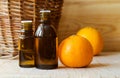 Small bottle with mandarin orange essential oil clementine extract, tincture, infusion, perfume. Aromatherapy and spa Royalty Free Stock Photo