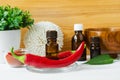 Small bottle with red chili pepper tincture and fresh chili pepper for preparing homemade healing hair mask Royalty Free Stock Photo