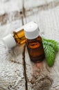 Small bottles of essential spruce (fir) oil Royalty Free Stock Photo
