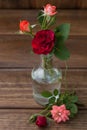 Small bouquet of roses on a wooden background Royalty Free Stock Photo