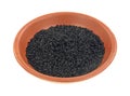 Small bowl of black caraway seeds