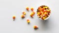 A small bowl of candy corn with some spilled out to the left. Royalty Free Stock Photo