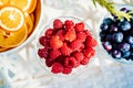 a small bowl with fresh raspberries. summer harvest of berries. Royalty Free Stock Photo