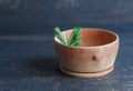 Small bowl made of juniper wood with juniper branch Royalty Free Stock Photo