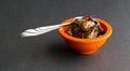 Small bowl of smoked oysters with a fork Royalty Free Stock Photo