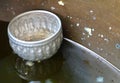 Small Bowls Floating on The Holy Water