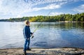 Small boy with big fishing rod Royalty Free Stock Photo