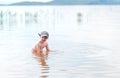 Small boy with blonde hair have fun in sea swimming, summertime, hardening